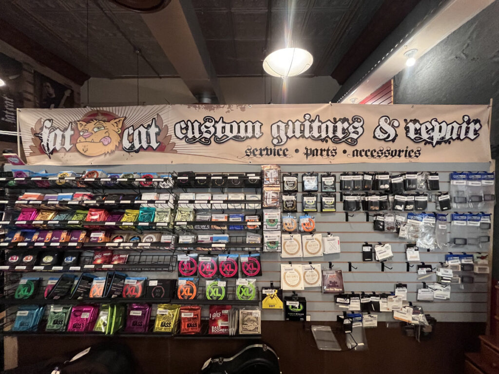 accessories rack at repair shop at fat cat custom guitars