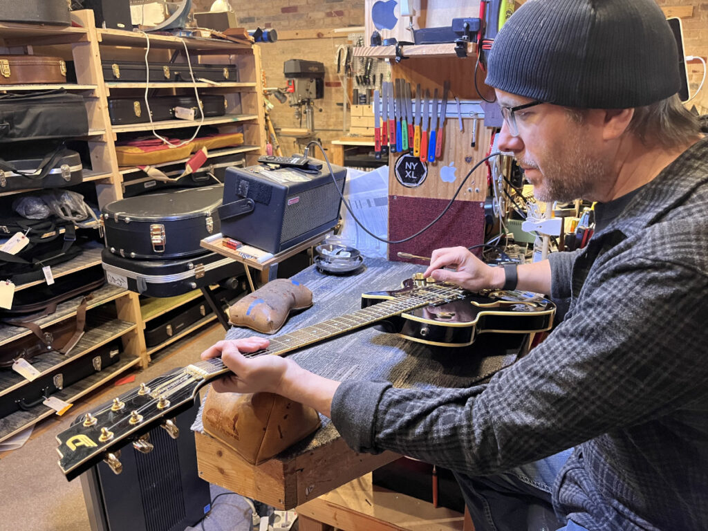 scott bond in the repair shop at fat cat custom guitars 01