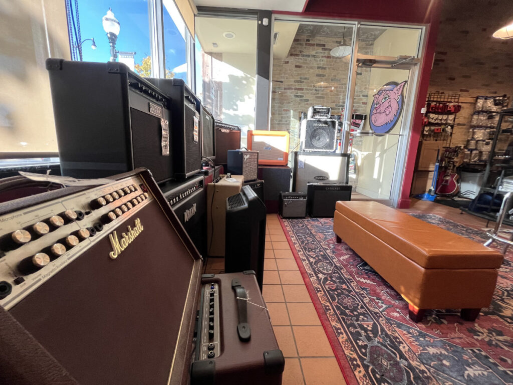 so many amps at repair shop at fat cat custom guitars